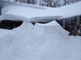 Snow piled high at the front door